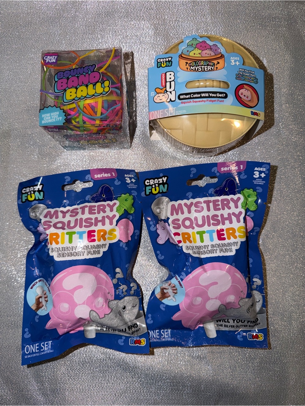 1 Mystery Dumpling, 2 Mystery Squishy Critters Blind Bags & 1 Bouncy Band Ball